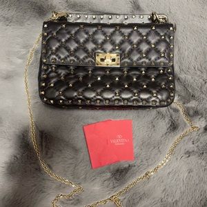 Valentino Garavani
Rockstud Quilted Leather Top Handle Bag